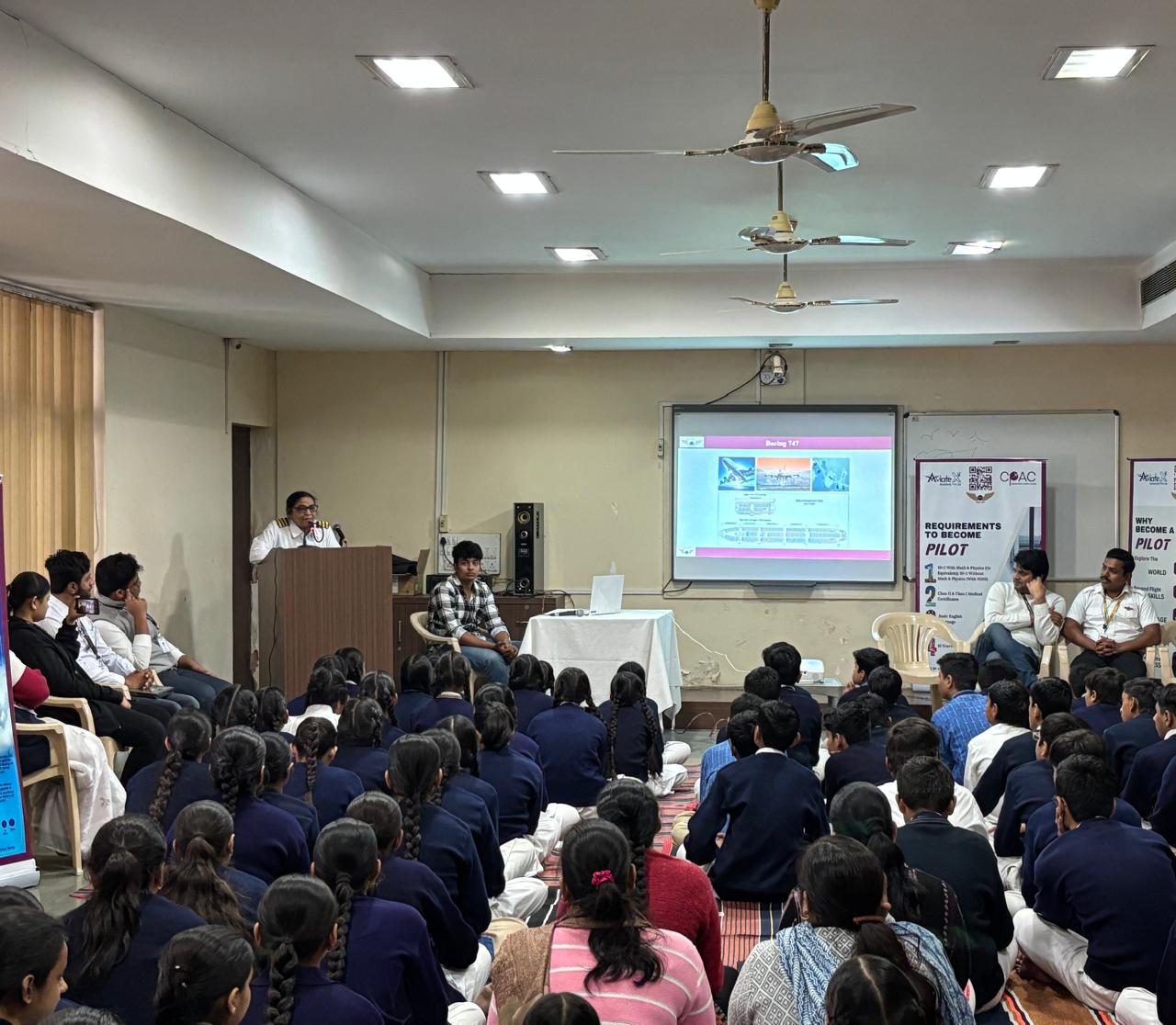 Captain Preeti conducting an aviation seminar for aspiring pilots